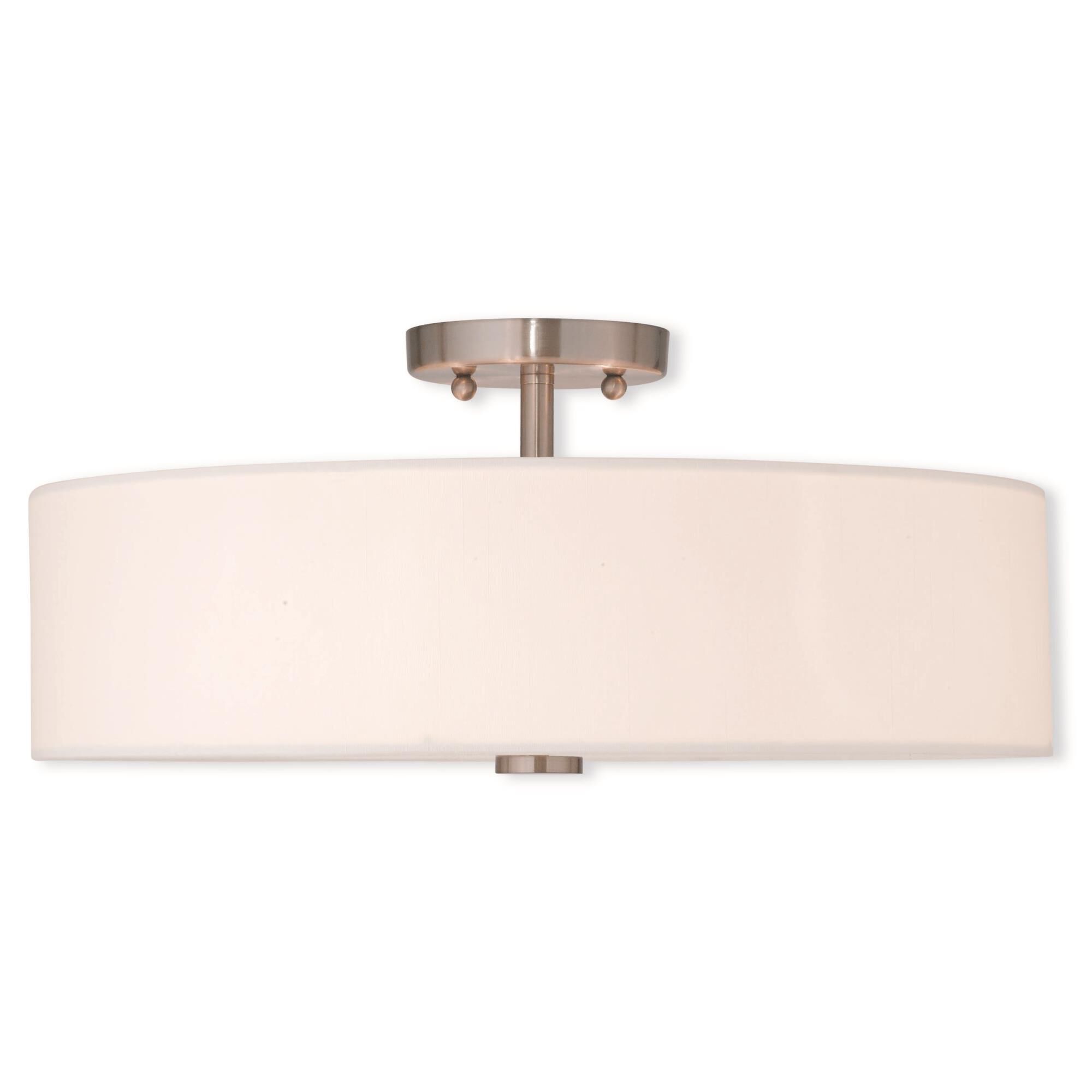 Shown in Brushed Nickel finish and Hand Crafted Off-White Fabric Hardback shade